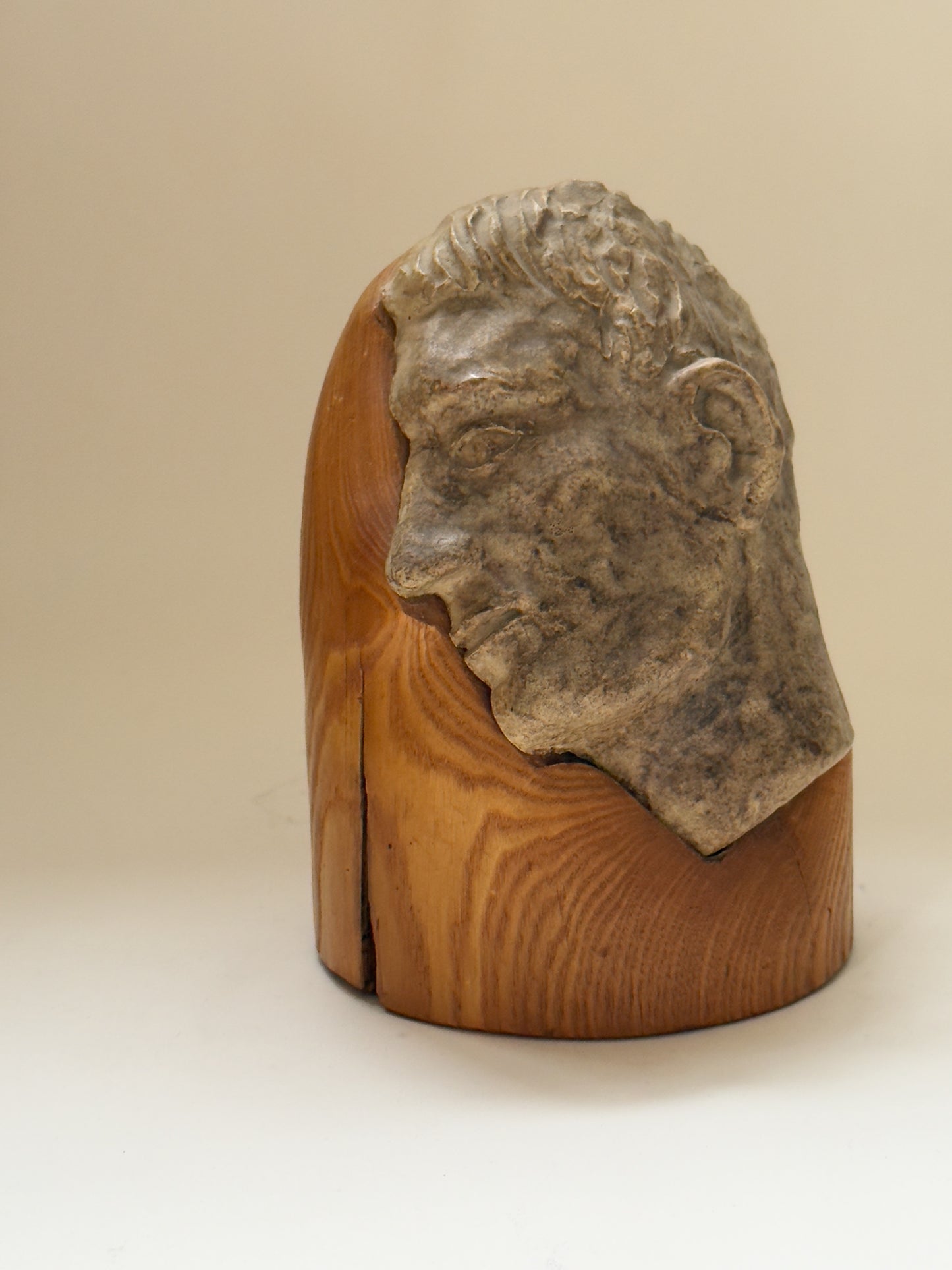 Face Sculpture on Wooden Pedestal