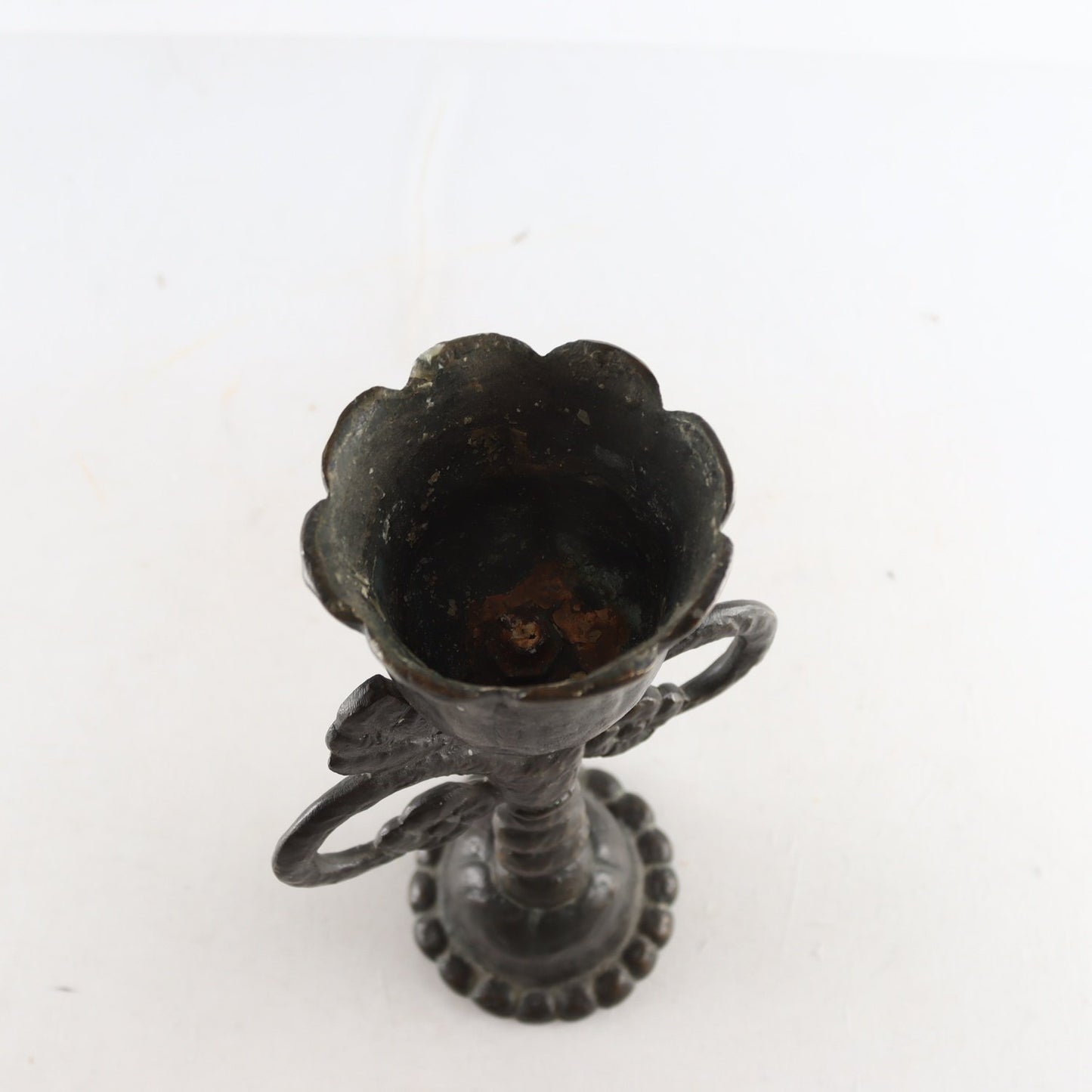Wrought iron, bronze candle holder